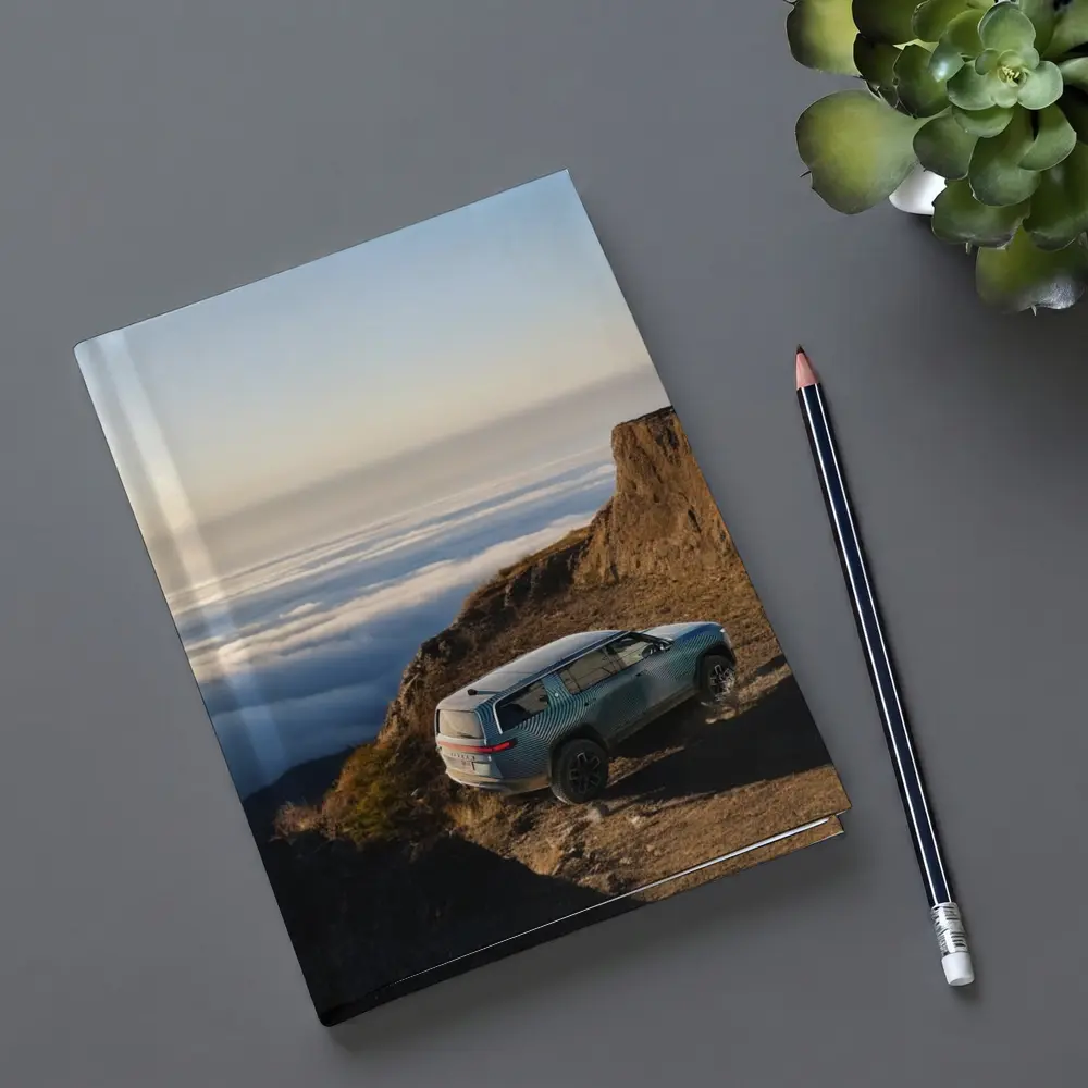 Rivian R1S SUV Above Mountain Clouds – Notebooks