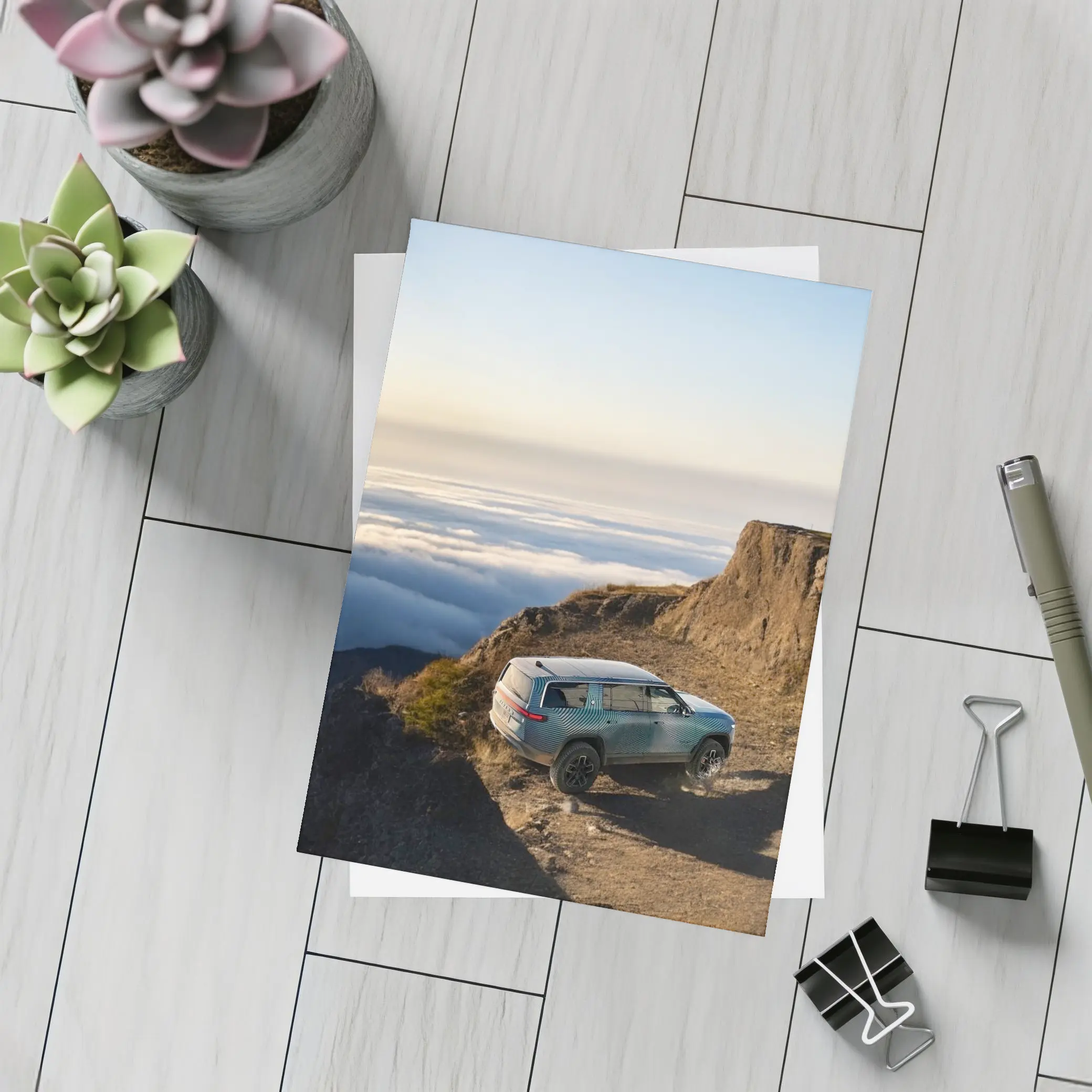 Rivian R1S SUV Above Mountain Clouds – Postcards