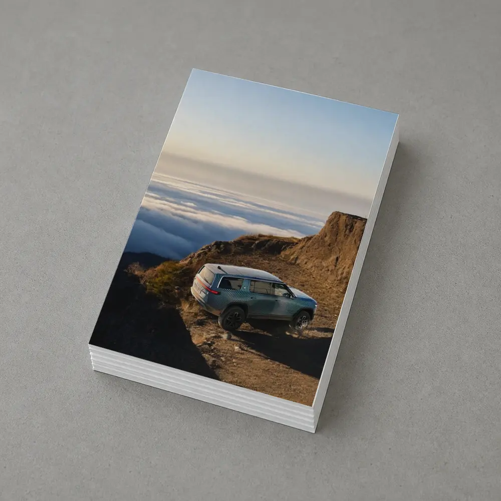 Rivian R1S SUV Above Mountain Clouds – Postcards