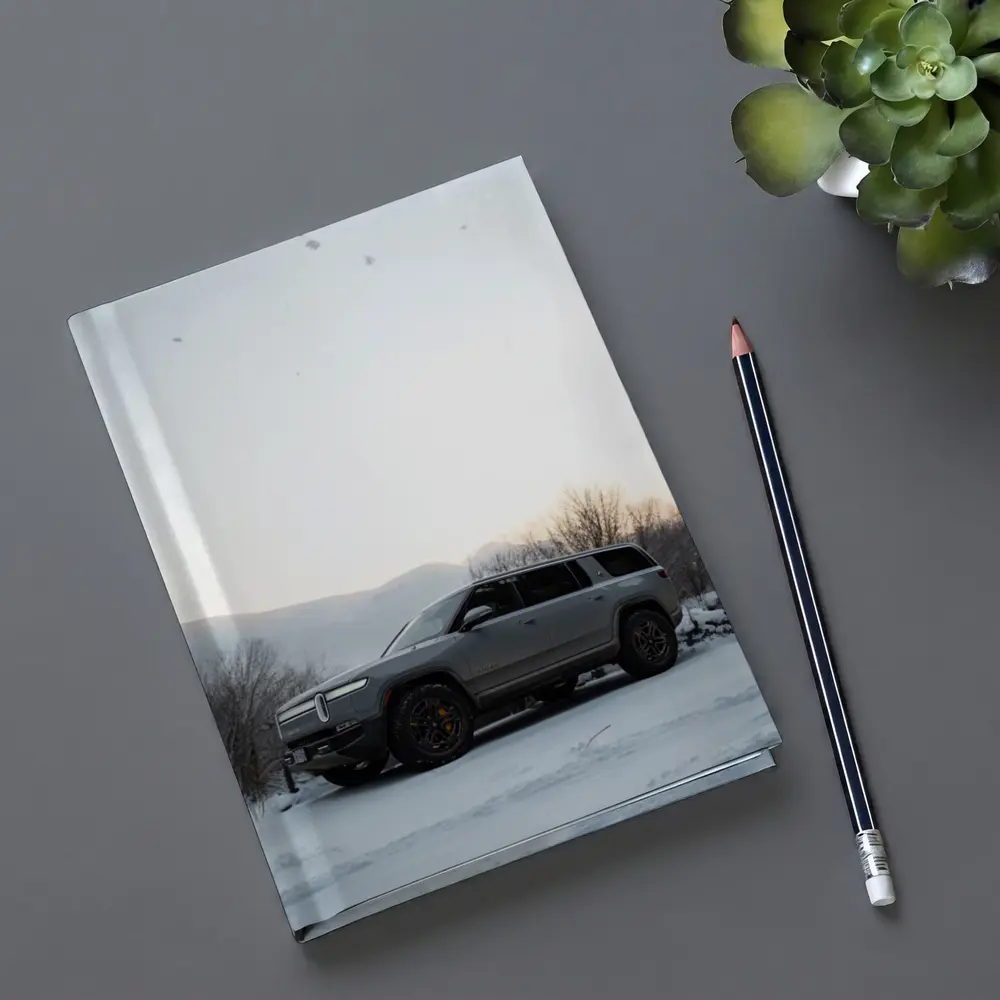 Rivian R1S SUV Parked in Winter Snow – Notebooks