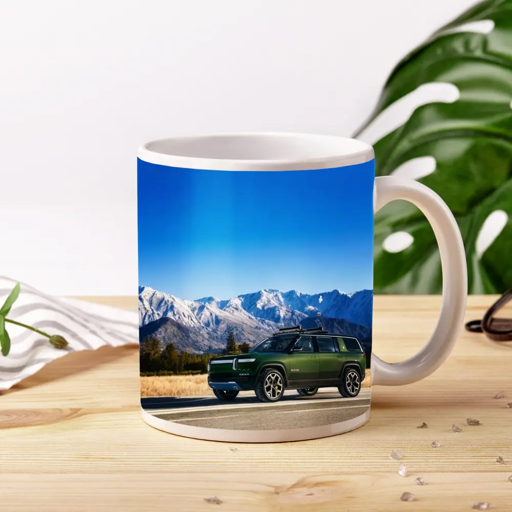 Rivian R1S Green SUV Snowy Mountains – Mugs