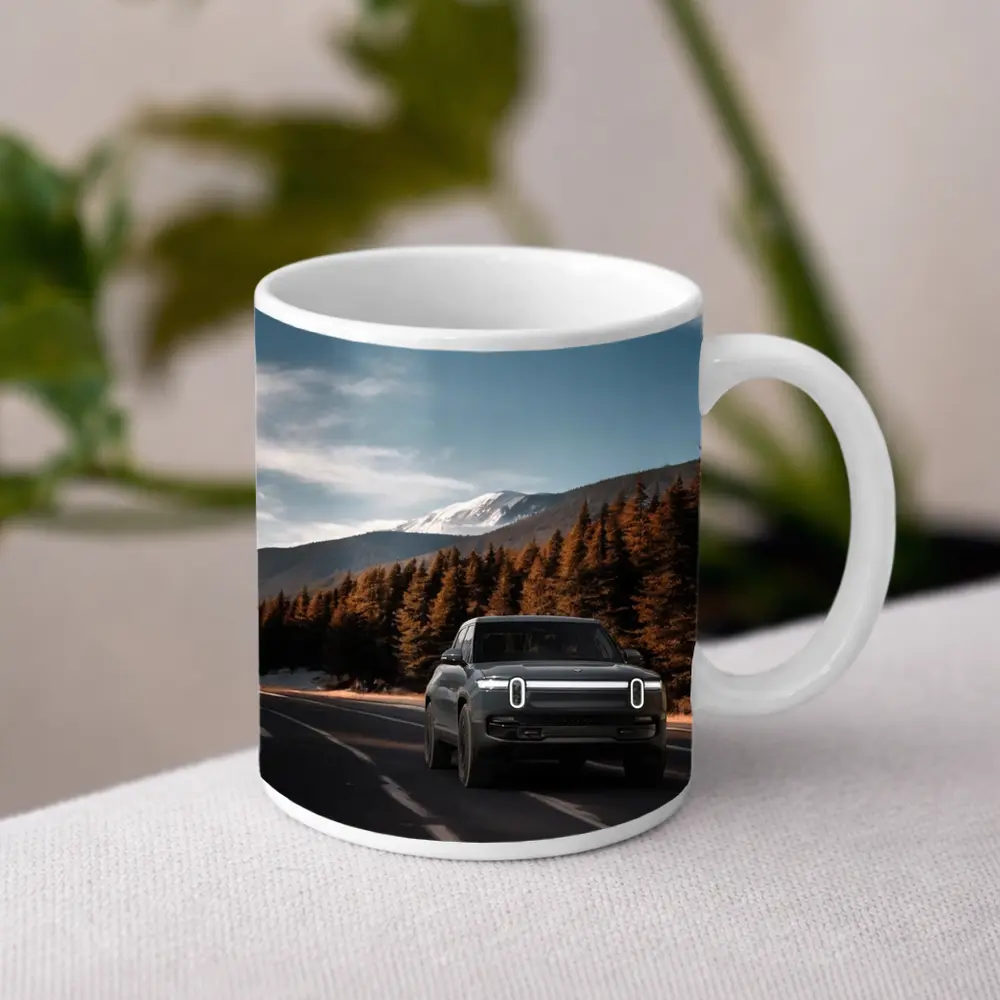 Rivian R1S on Mountain Road Forest Background – Mugs