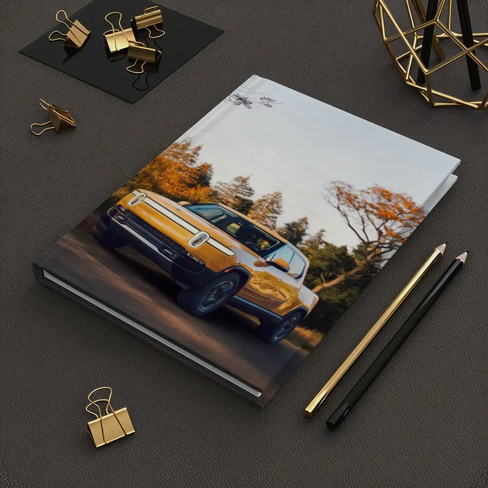 Rivian R1T Electric Truck Autumn Forest Setting – Notebooks