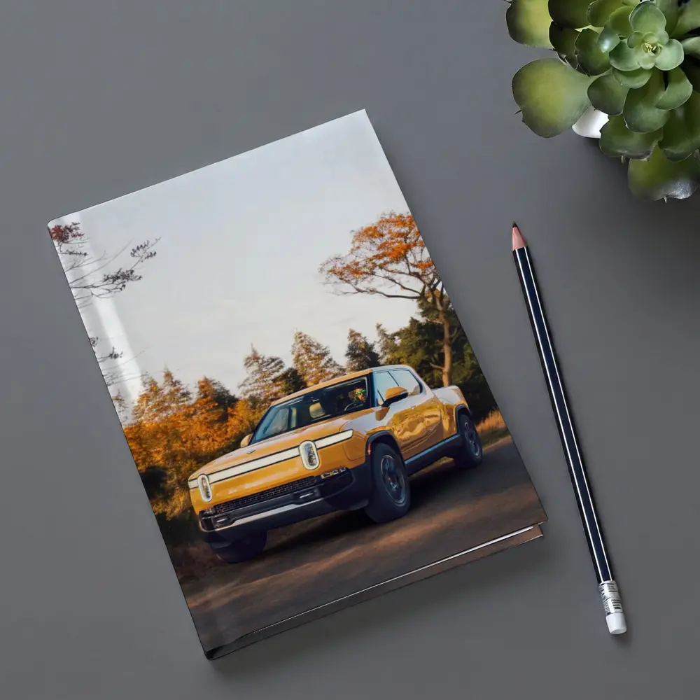 Rivian R1T Electric Truck Autumn Forest Setting – Notebooks