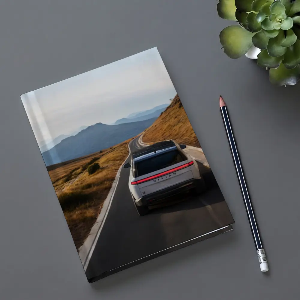 Rivian R1S On Mountain Road At Dusk – Notebooks