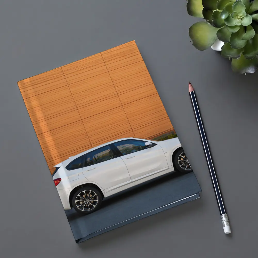 BMW X1 White Side View Orange Wall – Notebooks