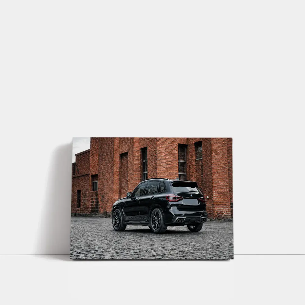 Black BMW X5M Parked Near Brick Building – Wall Art