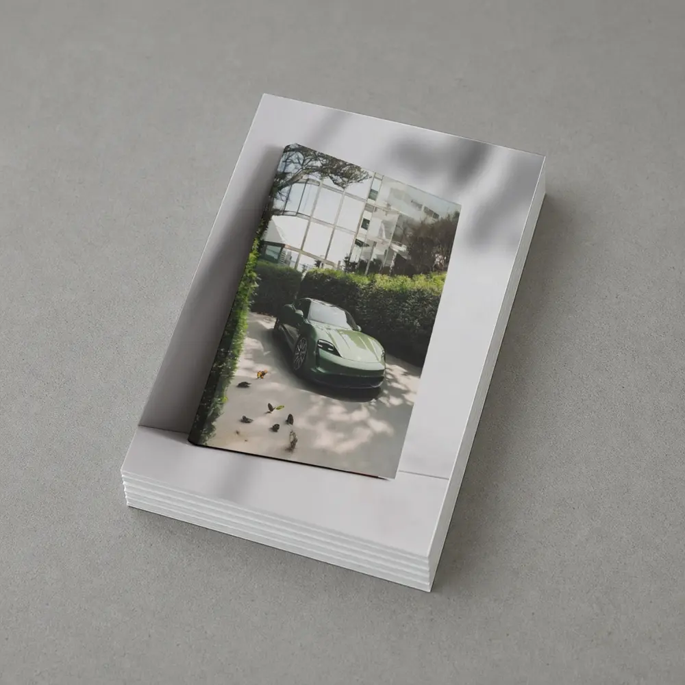 Green Porsche Taycan Parked By Glass Building – Postcards