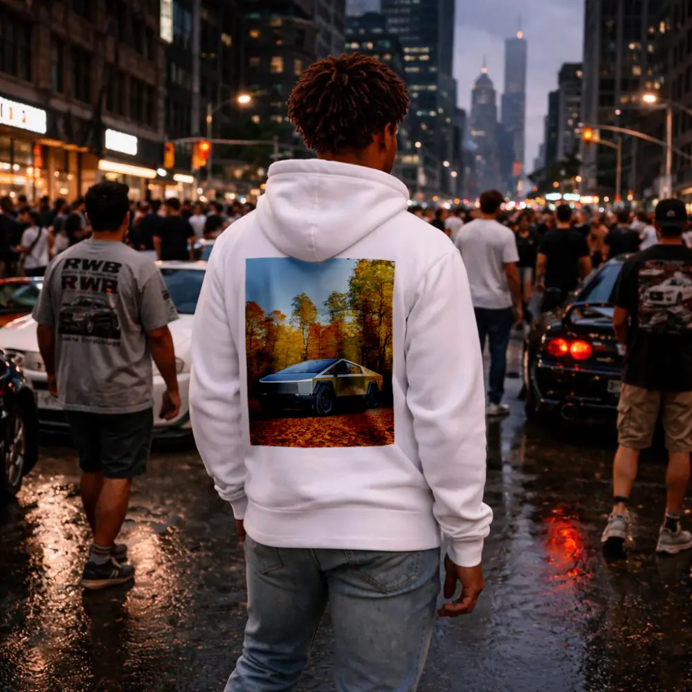 Tesla Cybertruck Parked Among Autumn Trees – Hoodies