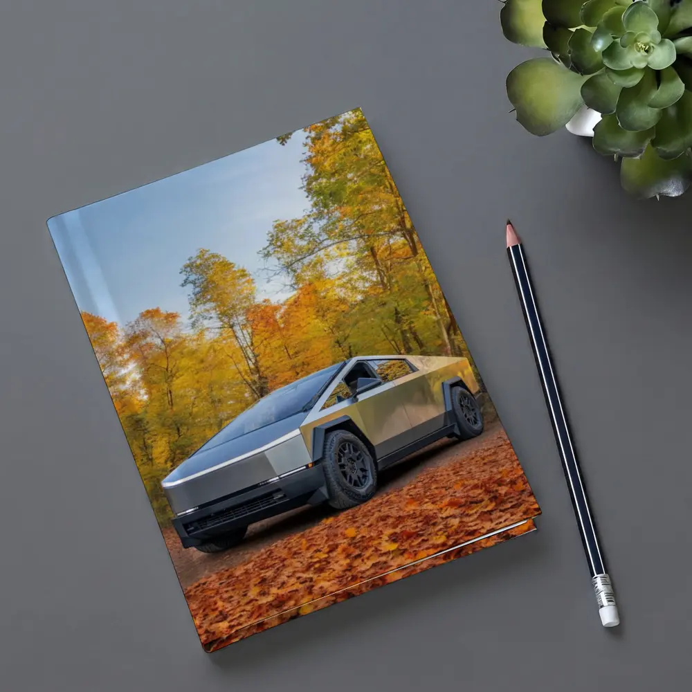 Tesla Cybertruck Parked Among Autumn Trees – Notebooks