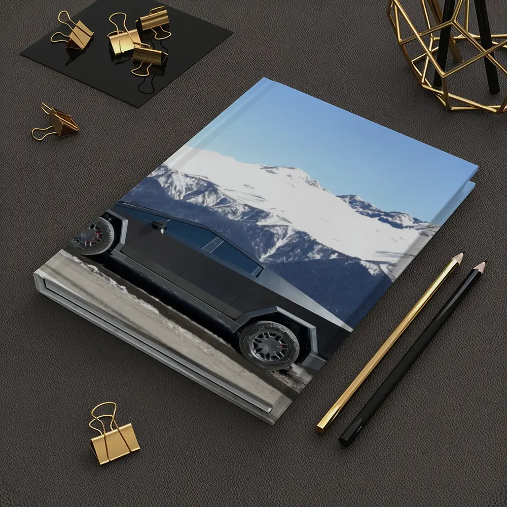 Tesla Cybertruck Parked Against Snowy Mountains – Notebooks