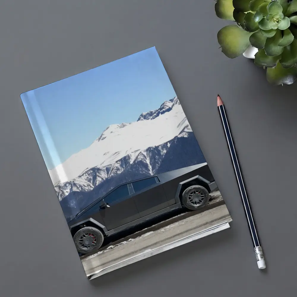 Tesla Cybertruck Parked Against Snowy Mountains – Notebooks