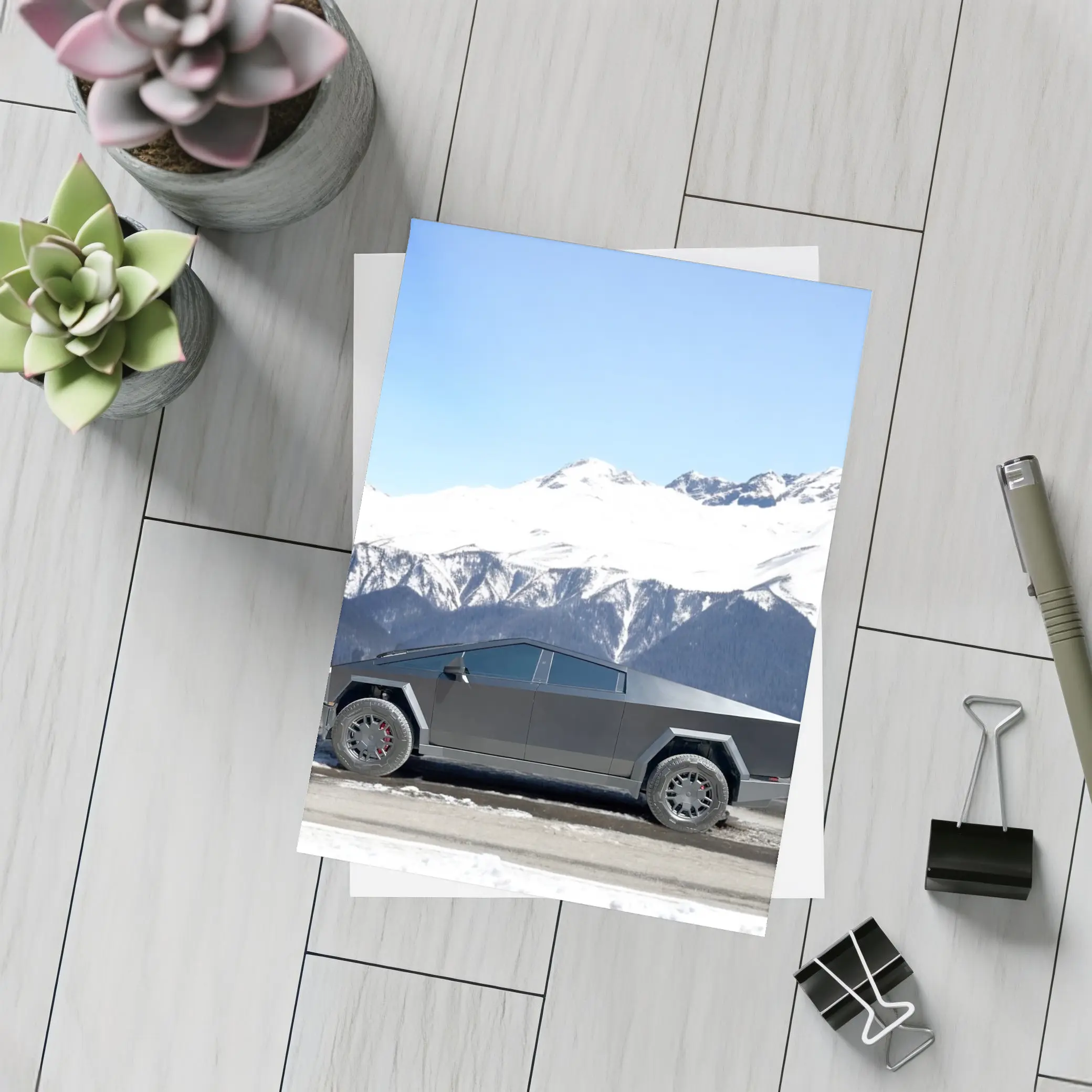 Tesla Cybertruck Parked Against Snowy Mountains – Postcards