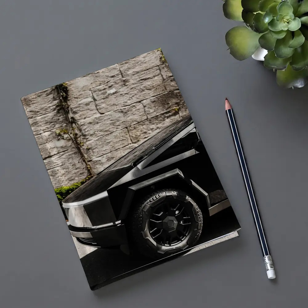Tesla Cybertruck Black Against Stone Wall – Notebooks