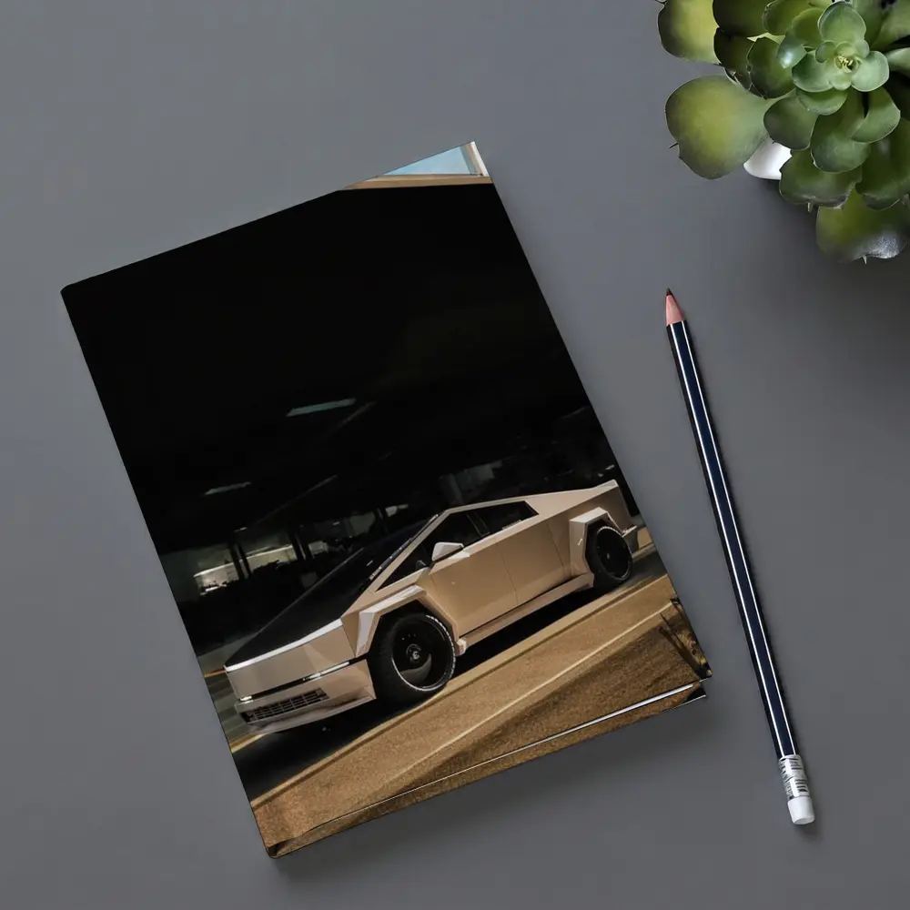 Tesla Cybertruck Parked Under Dark Overhang – Notebooks
