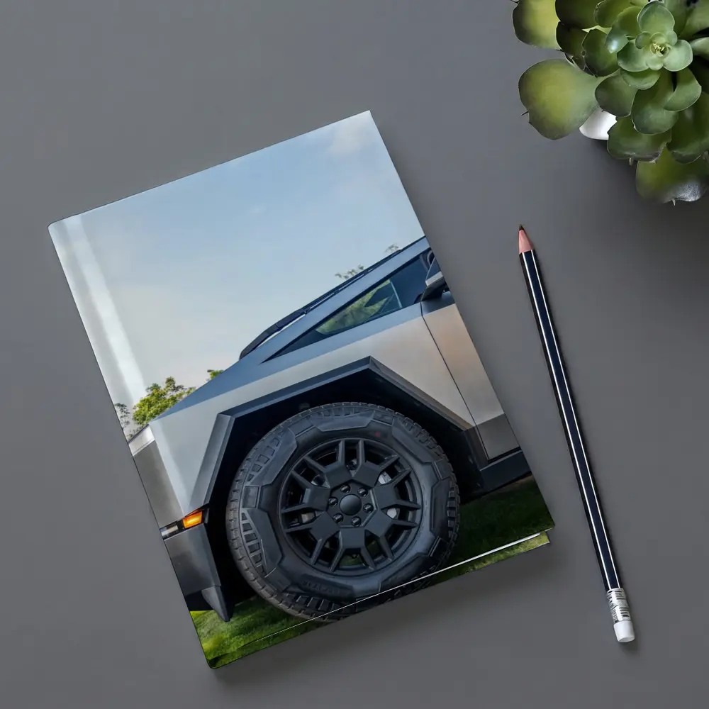 Tesla Cybertruck Parked On Green Grass – Notebooks