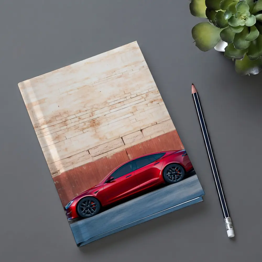 Red Tesla Model S Against Stone Wall – Notebooks