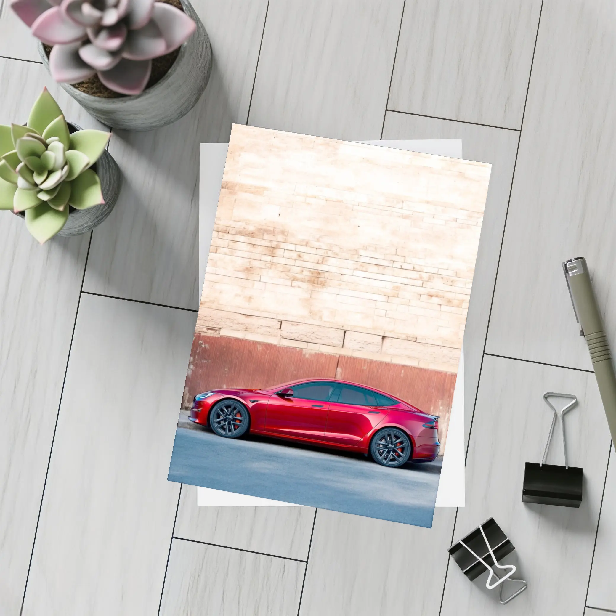 Red Tesla Model S Against Stone Wall – Postcards