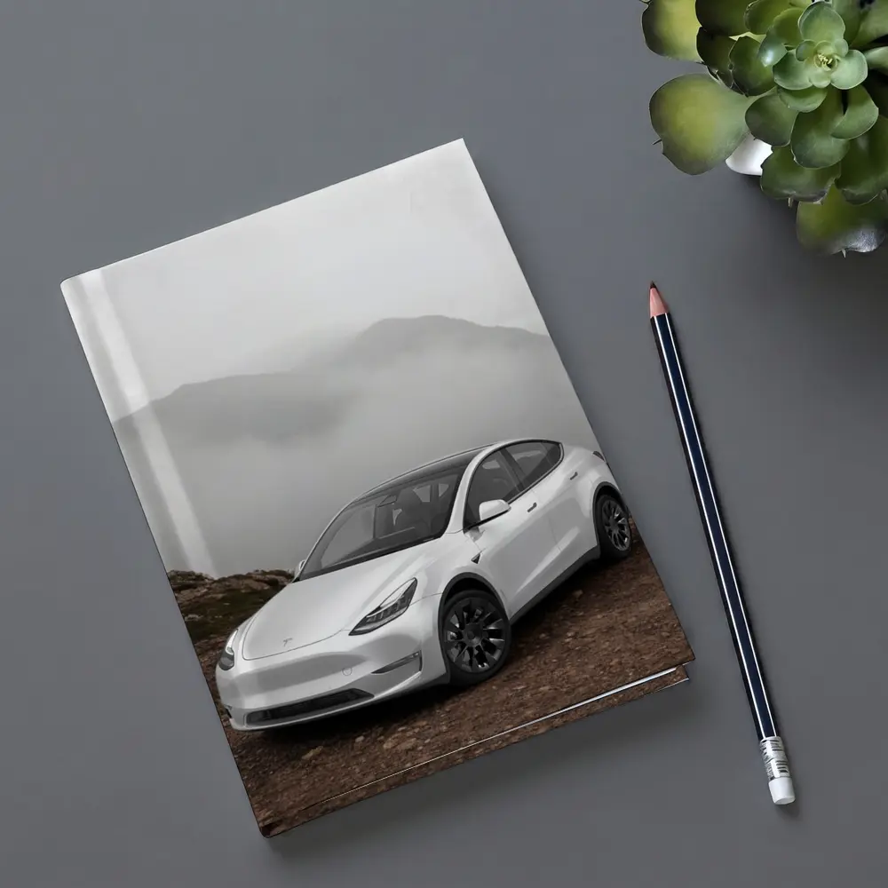 Tesla Model Y White Foggy Mountain Setting – Notebooks