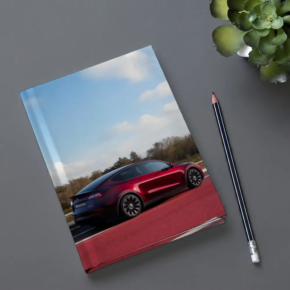 Tesla Model Y Red Street Blue Sky – Notebooks