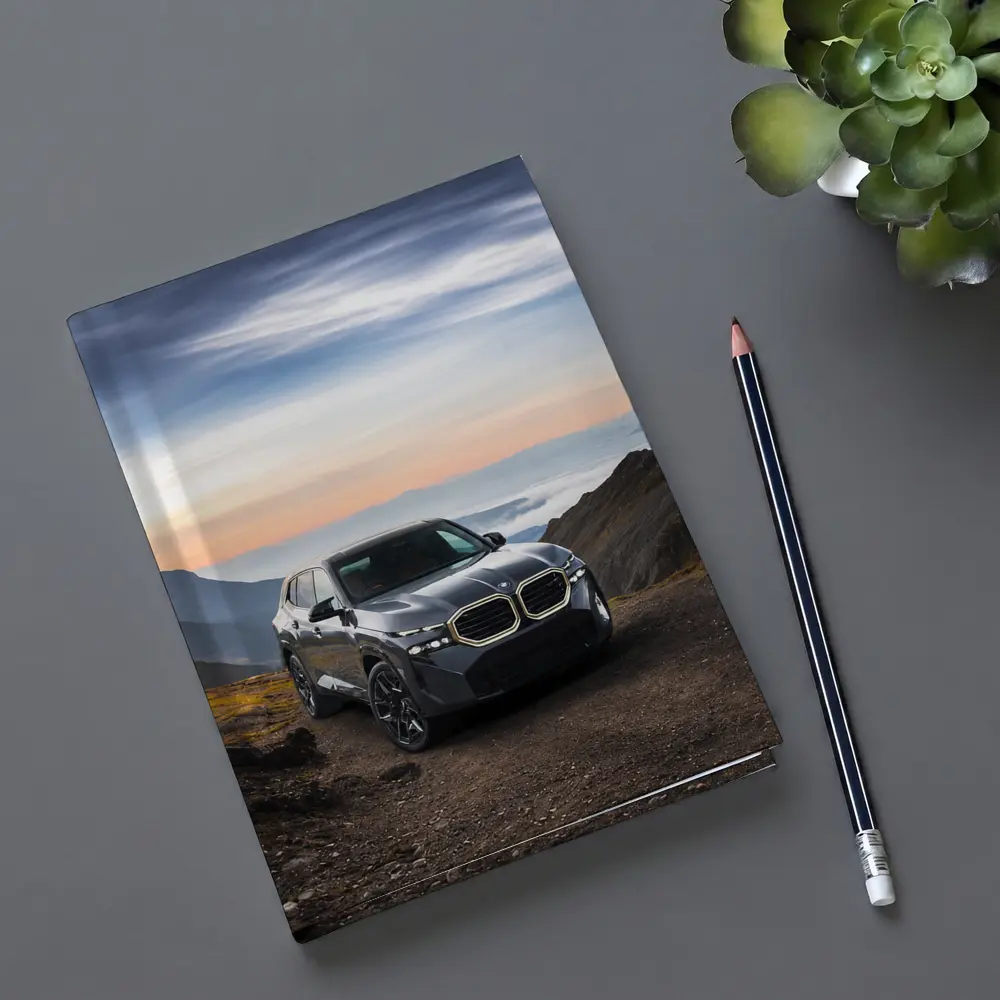 BMW XM SUV Mountain Road Dramatic Sky – Notebooks