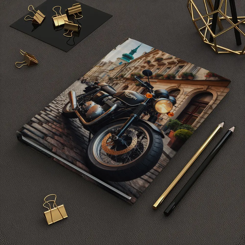 Triumph Motorcycle Parked on European Cobblestone Street – Notebooks