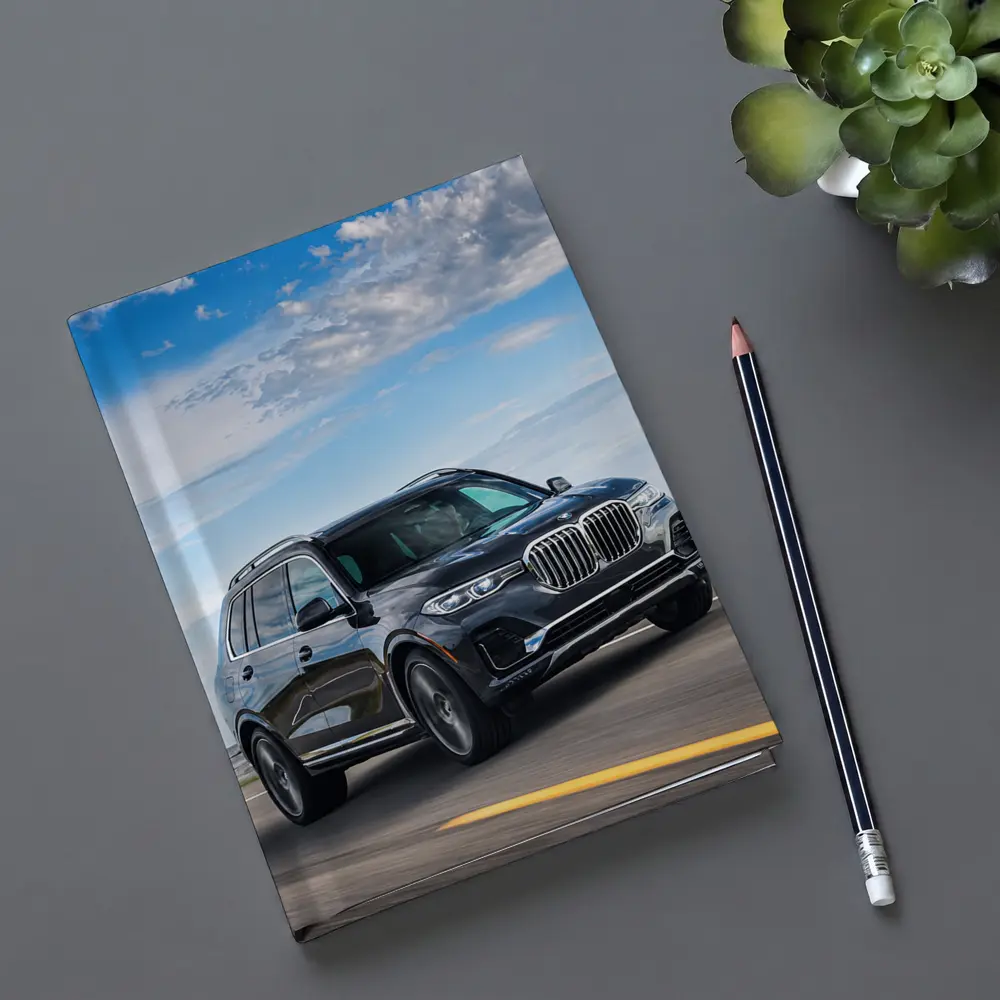 BMW X7 SUV Driving on Open Road – Notebooks
