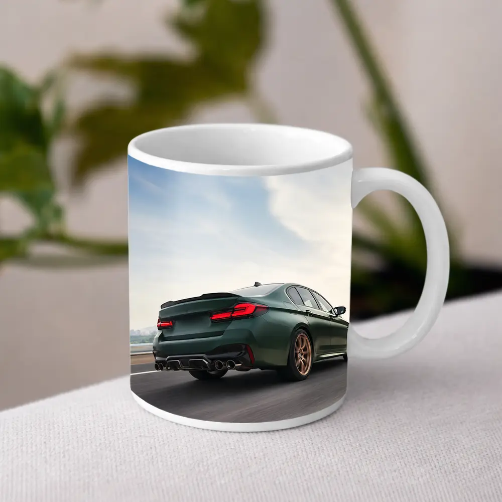 BMW M5 CS Green Sedan on Open Highway – Mugs