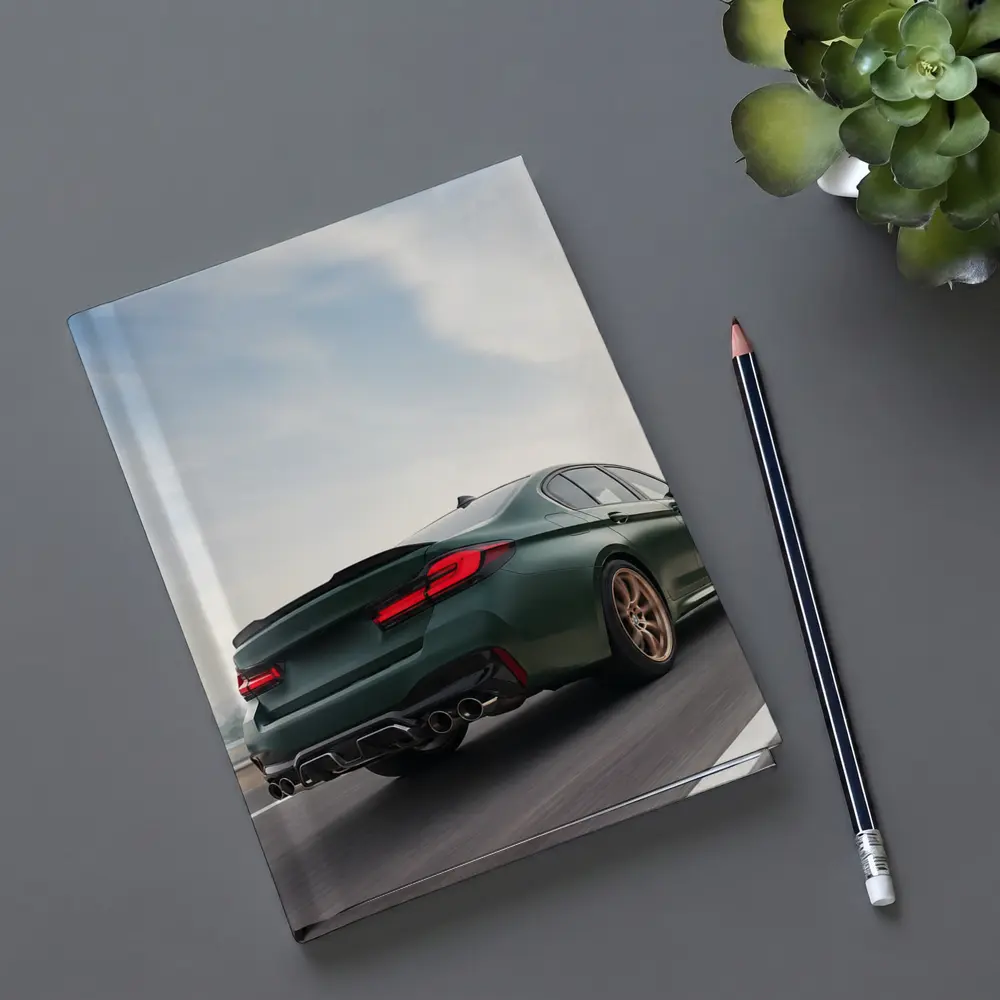 BMW M5 CS Green Sedan on Open Highway – Notebooks