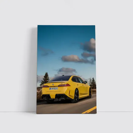 BMW M5 Yellow Sedan On Open Road