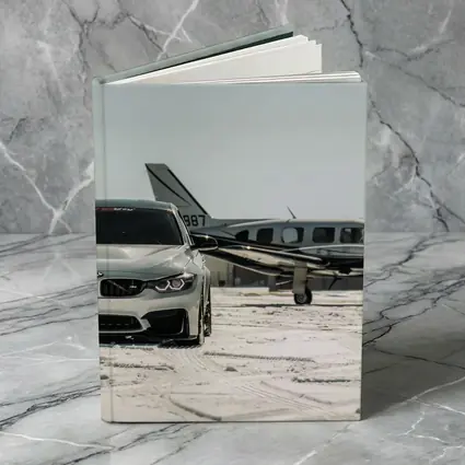 BMW M4 Silver Parked Near Private Jet