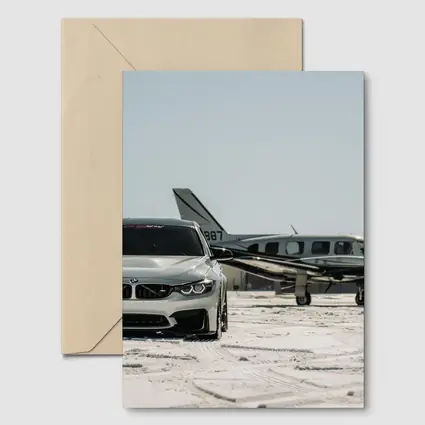 BMW M4 Silver Parked Near Private Jet