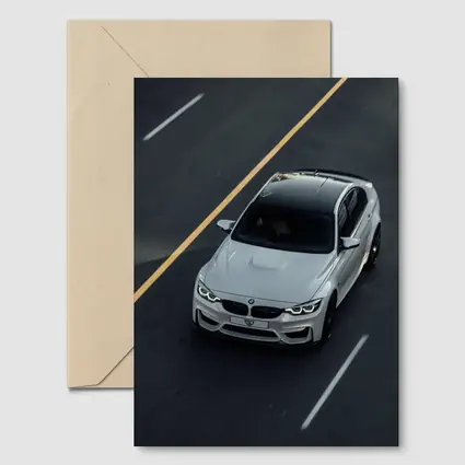 BMW M4 White Sedan on Open Road