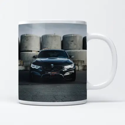 Black BMW M4 Front View Industrial Background