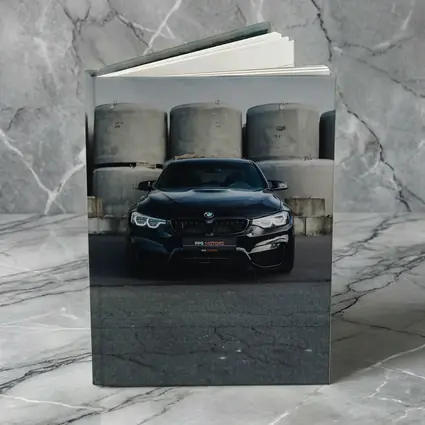 Black BMW M4 Front View Industrial Background