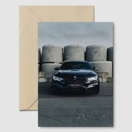 Black BMW M4 Front View Industrial Background