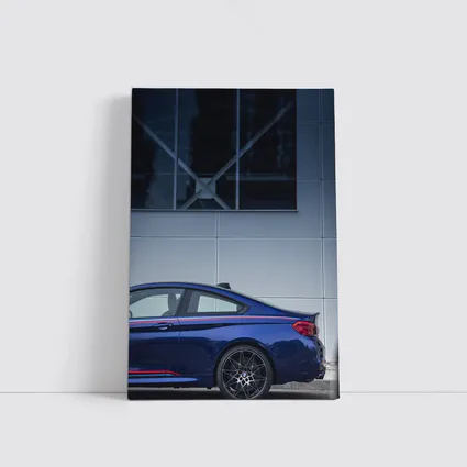 BMW M4 Blue Coupe Against Modern Building