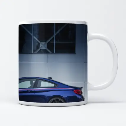 BMW M4 Blue Coupe Against Modern Building