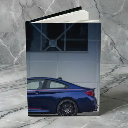 BMW M4 Blue Coupe Against Modern Building