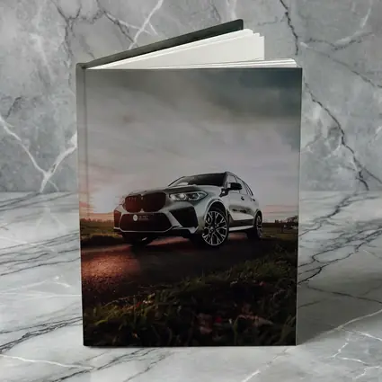 BMW X5M Silver SUV Dramatic Cloudy Sunset