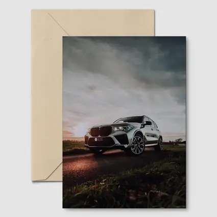 BMW X5M Silver SUV Dramatic Cloudy Sunset