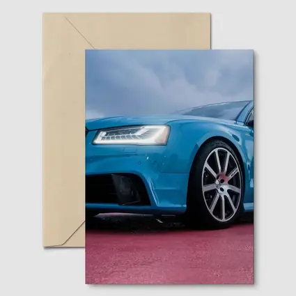 Audi RS Blue Sedan Dramatic Sky Background