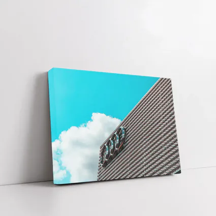 Audi Logo on Building Against Blue Sky