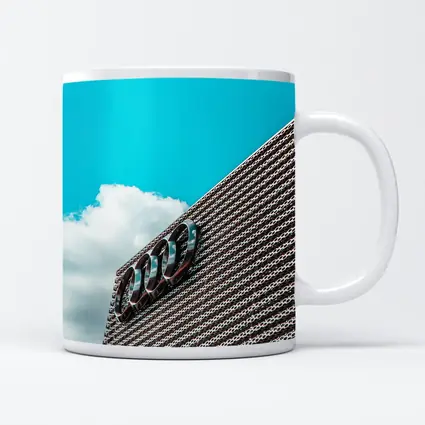 Audi Logo on Building Against Blue Sky