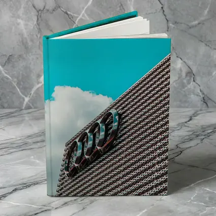 Audi Logo on Building Against Blue Sky