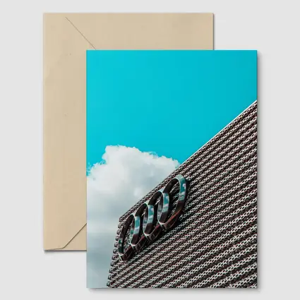 Audi Logo on Building Against Blue Sky