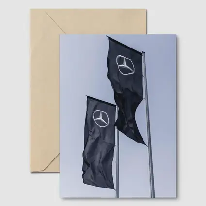 Mercedes Benz Flags Against Gray Sky