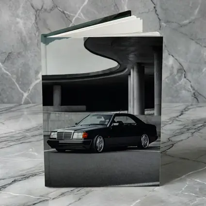 Black Mercedes W124 Coupe Urban Parking Structure