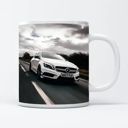 Mercedes AMG White Hatchback On Open Road