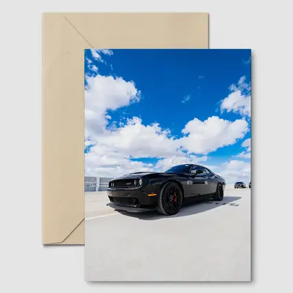 Black Dodge Challenger SRT Under Blue Sky
